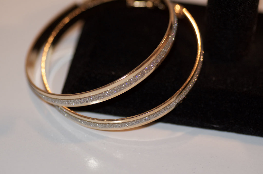 Gold and silver hoop earring