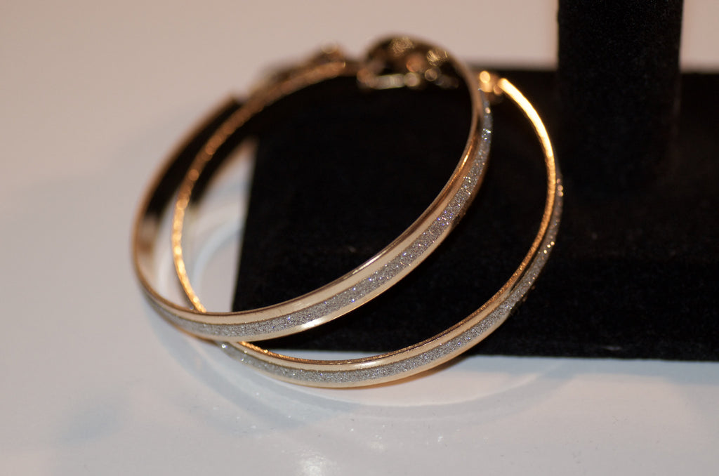 Gold and silver hoop earring