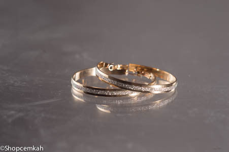 Gold and silver hoop earring